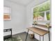 This office has a minimalist aesthetic with a desk and natural light at 2205 N Riverside Dr, Tampa, FL 33602