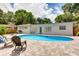 Inviting backyard pool with paver patio and well-maintained landscaping, creating a serene outdoor oasis at 2205 N Riverside Dr, Tampa, FL 33602