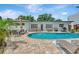 Beautiful backyard pool with paver patio, lounge chairs, and an outdoor dining area for entertaining guests at 2205 N Riverside Dr, Tampa, FL 33602