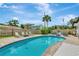 Backyard view of a sparkling pool surrounded by a brick patio and lush landscaping at 2205 N Riverside Dr, Tampa, FL 33602