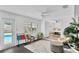 Bright sunroom with white walls, wicker chairs, ceiling fan and a view of the pool at 2205 N Riverside Dr, Tampa, FL 33602
