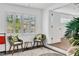Cozy sunroom with shutters, wicker chairs, and view to the outdoors at 2205 N Riverside Dr, Tampa, FL 33602