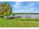 Beautiful waterfront scene with a rustic dock, providing a tranquil retreat and picturesque views at 2205 N Riverside Dr, Tampa, FL 33602