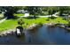 Stunning waterfront property with a private dock, lush landscaping, and serene water views at 2205 N Riverside Dr, Tampa, FL 33602