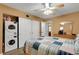Bedroom with in-unit washer and dryer, closet, wood-look floors, and ceiling fan at 2256 Philippine Dr # 24, Clearwater, FL 33763