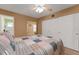 Spacious bedroom with a ceiling fan, closet, and an entrance to a connected room at 2256 Philippine Dr # 24, Clearwater, FL 33763