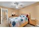 Cozy bedroom with wood floors, ceiling fan, and dresser with a mirror at 2256 Philippine Dr # 24, Clearwater, FL 33763