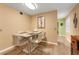 View of dining table with seating for six and a pass-through to the living room at 2256 Philippine Dr # 24, Clearwater, FL 33763
