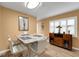 A dining area features a modern table with seating and a cabinet with wine storage at 2256 Philippine Dr # 24, Clearwater, FL 33763