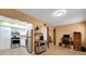 Open layout with kitchen and living space featuring neutral tones and wood-look flooring at 2256 Philippine Dr # 24, Clearwater, FL 33763