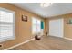 Inviting living area featuring shuttered windows, wood-look flooring, and neutral-toned walls at 2256 Philippine Dr # 24, Clearwater, FL 33763