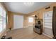 Neutral-toned living space with shuttered windows, a storage area and warm wood-look flooring at 2256 Philippine Dr # 24, Clearwater, FL 33763