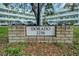 A brick sign reads 'Dorado 2256' in front of the building, surrounded by lush grass at 2256 Philippine Dr # 24, Clearwater, FL 33763