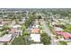 Explore the neighborhood from above, admiring the serene streets and beautiful homes at 2418 Cardwell Way, Sarasota, FL 34231