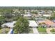 A beautiful aerial view showcases the lush landscaping and neighborhood charm of the home at 2418 Cardwell Way, Sarasota, FL 34231