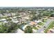 An aerial view shows the neighborhood featuring mature trees and well-maintained homes at 2418 Cardwell Way, Sarasota, FL 34231