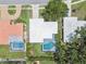See an aerial view highlighting the private pool and manicured landscaping of this beautiful property at 2418 Cardwell Way, Sarasota, FL 34231
