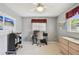 Study room featuring carpeted floors, maps, a desk, and a ceiling fan at 2418 Cardwell Way, Sarasota, FL 34231