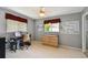Functional bedroom with a desk, storage dresser, and ample natural light at 2418 Cardwell Way, Sarasota, FL 34231