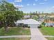 Lovely single-story home boasts a well-manicured lawn and a spacious two-car garage at 2418 Cardwell Way, Sarasota, FL 34231
