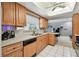 Well-lit kitchen featuring white countertops, ample cabinet space, and essential appliances at 2418 Cardwell Way, Sarasota, FL 34231