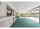 The covered patio offers a shaded retreat with views of the pool area at 2418 Cardwell Way, Sarasota, FL 34231