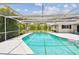 Enjoy the outdoors in your pool year round thanks to a large screened enclosure at 2418 Cardwell Way, Sarasota, FL 34231