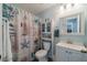 Charming bathroom with a vanity, a seashell-themed shower curtain, and a matching nautical decor at 2457 E Del Webb Blvd, Sun City Center, FL 33573