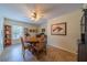 Dining room with a classic wooden table, comfortable chairs, and ample natural light at 2457 E Del Webb Blvd, Sun City Center, FL 33573