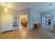 Inviting entryway featuring neutral paint, decorative lighting, and easy access to the dining area at 2457 E Del Webb Blvd, Sun City Center, FL 33573