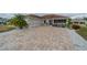 Beautiful home with a paver driveway, two car garage, and inviting front porch in a well-maintained community at 2457 E Del Webb Blvd, Sun City Center, FL 33573