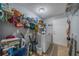 Functional laundry room with ample shelving and storage space, plus appliances at 2457 E Del Webb Blvd, Sun City Center, FL 33573