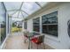 Charming outdoor patio with a bistro table and chairs, perfect for enjoying the pleasant weather at 2457 E Del Webb Blvd, Sun City Center, FL 33573