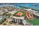 Waterfront condo complex featuring community pool and boat docks on a scenic coast at 255 Dolphin Pt # 207, Clearwater Beach, FL 33767