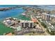 Stunning aerial view showing the marina, coastline, and neighborhood at 255 Dolphin Pt # 207, Clearwater Beach, FL 33767