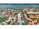 Aerial view of the condominium complex, pool and surrounding neighborhood at 255 Dolphin Pt # 207, Clearwater Beach, FL 33767