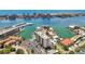 Condo building with waterfront view, marinas, and outdoor pool creating a serene and enjoyable living environment at 255 Dolphin Pt # 207, Clearwater Beach, FL 33767