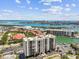 Aerial view of building, marina and surrounding neighborhood at 255 Dolphin Pt # 207, Clearwater Beach, FL 33767
