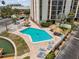 Community pool and landscaping for easy access to the community waterway at 255 Dolphin Pt # 207, Clearwater Beach, FL 33767
