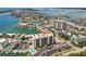 Sweeping aerial view highlighting the waterfront location, marina, and complex at 255 Dolphin Pt # 207, Clearwater Beach, FL 33767