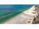 Beautiful beach scene with clear blue water and sandy shoreline, ideal for relaxation and recreation at 255 Dolphin Pt # 207, Clearwater Beach, FL 33767