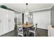 Cozy dining area with storage, polished floors, and modern décor at 255 Dolphin Pt # 207, Clearwater Beach, FL 33767