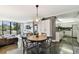 Living area with adjacent kitchen, polished floors, and comfortable decor at 255 Dolphin Pt # 207, Clearwater Beach, FL 33767