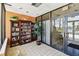 Well-lit lobby features built-in bookshelves and entrance with tiled floor at 255 Dolphin Pt # 207, Clearwater Beach, FL 33767
