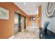Lobby area featuring elevators, tiled floors and accessibilty signage at 255 Dolphin Pt # 207, Clearwater Beach, FL 33767