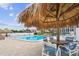 Enjoy the beautiful pool, shade palapas, table seating and waterfront views on a beautiful summer day at 255 Dolphin Pt # 207, Clearwater Beach, FL 33767