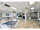 Bright recreation room offers tables and chairs for activities and socializing at 255 Dolphin Pt # 207, Clearwater Beach, FL 33767