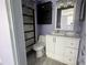 Bathroom featuring a modern vanity, toilet, and walk-in shower at 2619 Albion St, Holiday, FL 34691