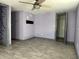 Bedroom featuring wood-look tile floors and a walk-in closet at 2619 Albion St, Holiday, FL 34691