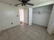 This bedroom features tile floors, a window, and a closet at 2619 Albion St, Holiday, FL 34691